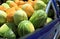 Melons on the back of blue pick-up truck