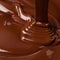 Melt dark chocolate, sweet background. liquid cocoa texture