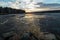 Melt the ice on the lake in spring at sunset, Urals, Russia,