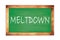MELTDOWN text written on green school board