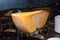 Melted cheese raclette at a french fair market