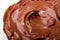 Melted chocolate. Chocolate swirl. Liquid chocolate as background