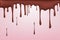 Melted chocolate leaking, dripping flowing streams of drops isolated on pink background , 3D rendering