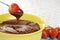 Melted chocolate and strawberry fondue
