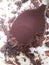 Melted dark chocolate hardened on spoon