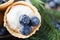 Melted ice cream in a bucket of blueberry.