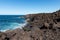 Melted Lava rocks magma flows from Timanfaya Volcanoes National Park, meets Atlantic Ocean. Lanzarote, Canary Islands