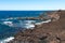 Melted Lava rocks magma flows from Timanfaya Volcanoes National Park, meets Atlantic Ocean. Lanzarote, Canary Islands