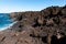 Melted Lava rocks magma flows from Timanfaya Volcanoes National Park, meets Atlantic Ocean. Lanzarote, Canary Islands