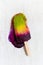 Melted Layers fruit ice lolly on a white background, natural sum