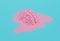 Melted pink brain on blue background