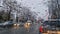 Melted snow and rain drops on the windshield of a car. Blurred outdoor view, winter season sleet as seen out of vehicle window