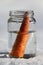 Melted snowman in winter waiting for the new winter season in the jar as a fresh carrot