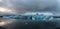 Melting glacier, blue icebergs float at Jokulsarlon glacier lagoon