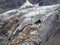 Melting glacier texture. Minimalist nature background of glacier surface with big cave and cracks. Minimal natural backdrop of icy