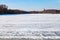 Melting ice on frozen lake