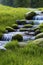 Melting ice, green grass and a crystal clear river in the springtime