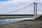 Melting ice on river floating under bridge. Spring season ice drift, high water and drift