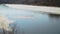 Melting of ice on the river, floe floating on river in spring