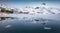 Melting ice on Vatterfjordpollen fjord. Misty spring view of Lofoten Islands, Svolvaer town location, Norway,