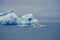 Melting icebergs in Iceland. Tourists in boats take a closer look.