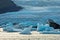 Melting of icebergs at Jokulsarlon glacier lagoon at sunset