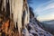 melting icicles on a mountain cliff