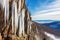 melting icicles on a mountain cliff