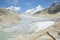 Melting Rhone Glacier partially covered by sheets in canton of Valais in Switzerland