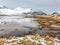 Melting snow and ice, low tide in Flakstadpollen bay, Flakstadoya, Lofoten islands, Nordland, Norway