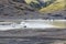 melting snow in puddle near Solheimajokull glacier