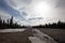 Melting snow and water in gravel riverbed under lenticular clouds in the spring in Denali National Park in Alaska USA