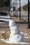 Melting snowman on public downtown street in Abilene, TX