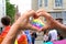 Members of LGBTq movement, Gay pride parade in city with rainbow flags, demonstration of people, mass march of lesbian, gay,