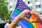 Members of LGBTq movement, Gay pride parade in city with rainbow flags, demonstration of people, mass march of lesbian, gay,