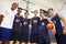 Members Of Male High School Basketball Team With Coach