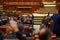 Members of Romanian Parliament vote by raising their hands