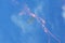 Memorial Airshow. Flying Glider aerobatic team withlight sailplane showing his performance, smoke effect