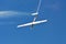 Memorial Airshow. Flying Glider aerobatic team withlight sailplane showing his performance, smoke effect