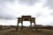 The memorial arch under the dark clouds