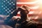 Memorial day. A uniformed soldier salutes against the background of the American flag. Side view. The concept of the American