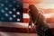 Memorial day, veterans day. Male hands folded in prayer, holding a rosary. The American flag is in the background. The concept