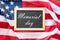 Memorial day words on chalkboard and american flag