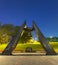 Memorial monument with bell in park near stadium in Donetsk