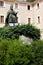 Memorial to bishop Pere-Joan Campins in cloistered courtyard of Santuario de lluc Monastery