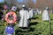 Memorial wreaths and flags near Statues of soldiers standing in rough terrain,Korean War Veteran\'s Memorial,Washington,DC,2015
