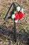 Memorial wreaths on a pole next to the road