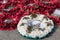 Memorial wreaths on teh ground.  St Patricks day and poppys