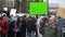 A men agitates by propaganda with a poster 4k. People at the demonstration with banners in their hands.