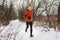 men athlete is jogging in a snowy landscape